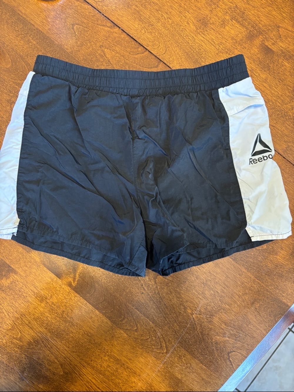 Reebok Black Shorts with white side panel and POCKETS! Size 10/12 girls